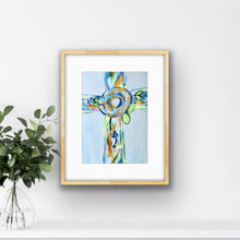Load image into Gallery viewer, Colorful Hope Cross Christian art print displayed in a girl's bedroom, featuring a contemporary floral cross in blue, green, gold, and white.
