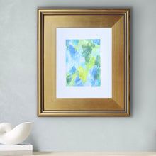 Load image into Gallery viewer, Original abstract painting titled Inspire displayed in a plein air frame with vibrant yellow, blue, green, and white brushwork creating movement and energy.
