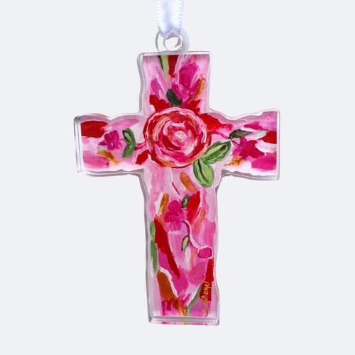 A Christian Cross Cut out Shape with shades of pink, red, green, gold and white. This is a lightweight acrylic ornament. It has a floral design and a white satin ribbon.