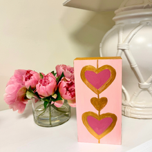 Load image into Gallery viewer, Modern pink and gold heart art block featuring original artwork by Jeanne Player, designed as a stylish tabletop shelf sitter, romantic gift, and contemporary home accent.
