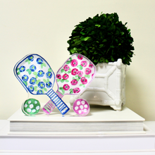 Load image into Gallery viewer, Modern pickleball acrylic art block showcasing a colorful paddle with floral motifs and double-sided visibility.
Freestanding pickleball paddle décor block created from Jeanne Player’s original artwork with bright floral accents.
