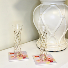 Load image into Gallery viewer, Set of two absorbent ceramic drink coasters with vibrant pink abstract artwork designed from an original painting by Jeanne Player.
