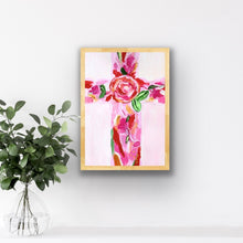 Load image into Gallery viewer, Close-up of Christian cross art print showing layered floral shapes in vibrant pink, red, green, white and gold.
