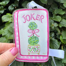 Load image into Gallery viewer, Close-up of pink mahjong Joker ornament with green and gold decorative details.
