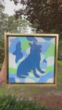 Load and play video in Gallery viewer, German shepherd art. An original painting on canvas.  The pop art style painting features a blue dog outlined in gold on a blue and green camo background.
