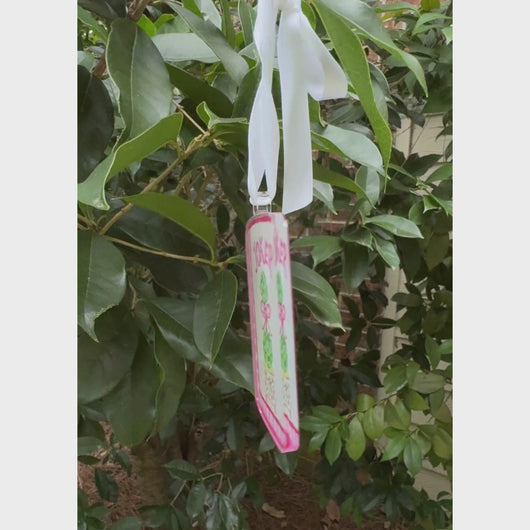 Mahjong ornament with shades of pink, white, green and gold feauring a double topiay design with a pink bow.