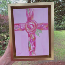 Load and play video in Gallery viewer, Religious wall decor featuring hand painted pink floral cross with layered acrylic textures. Original Christian artwork for women and girls with soft pink palette and gold accents. Small contemporary Christian cross art that can hang on wall or sit on tabletop display
