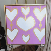 Load and play video in Gallery viewer, Luxury pink heart painting on canvas measuring 20 x 20 inches and ready to hang.
Whimsical contemporary heart artwork featuring bold white hearts against a vibrant pink background.
