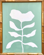 Load image into Gallery viewer, White flower leaf design on a green background with a gold frame.
