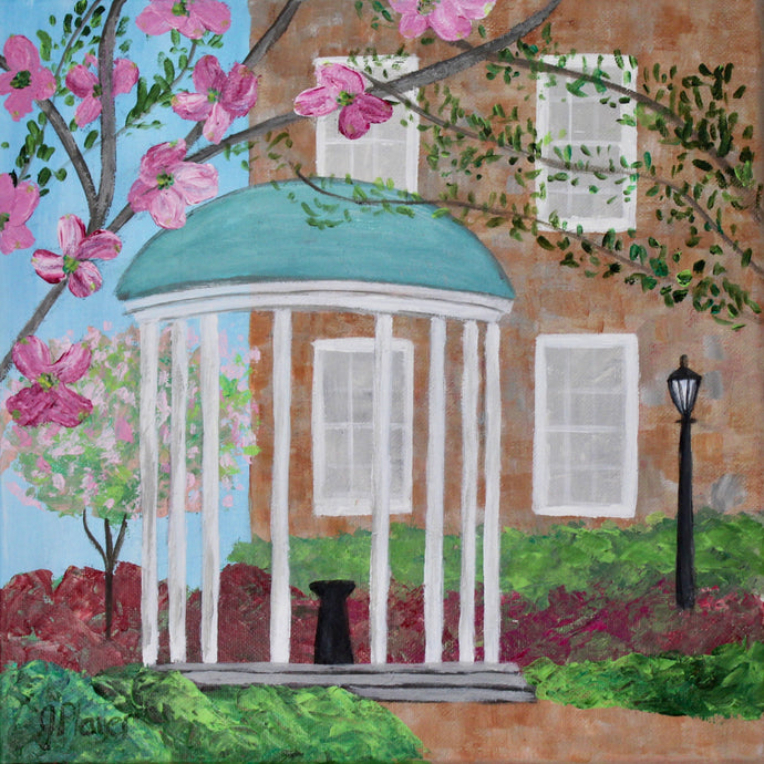 A colorful abstract landscape painting of the UNC Old Well. This painting has pink blooming flowers. Trees with leaves, and blooming azaleas. There is a building and lamp post int he background. Green shrubs and a brick walk way. The old well has a bluish green top and white post.