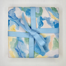 Load image into Gallery viewer, Sea glass ceramic coaster set featuring colorful ocean-inspired abstract art with cork backing, a stylish coastal gift for beach lovers, ocean enthusiasts, and summer homes.
