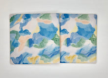 Load image into Gallery viewer, Square ceramic coasters with original coastal painting reproduction by Jeanne Player, featuring calming sea glass colors and modern abstract design for everyday entertaining.
